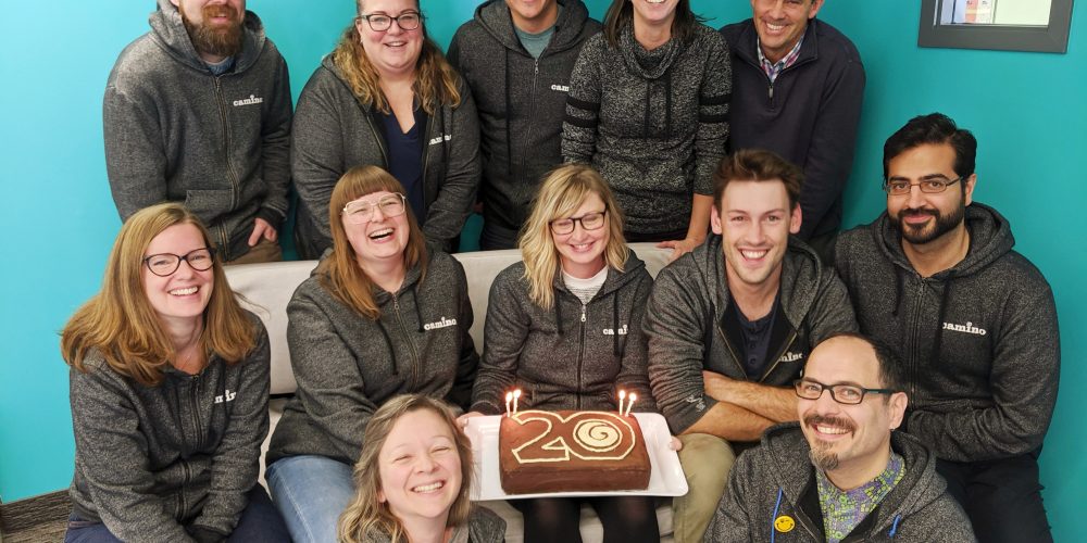 Camino staff with 20th birthday cake